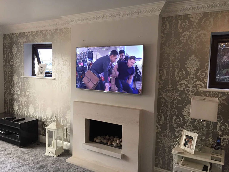 Reasons To Reconsider Hanging A TV Over A Fireplace