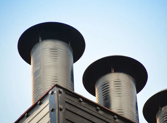 Aluminum chimney cap on masonry chimney