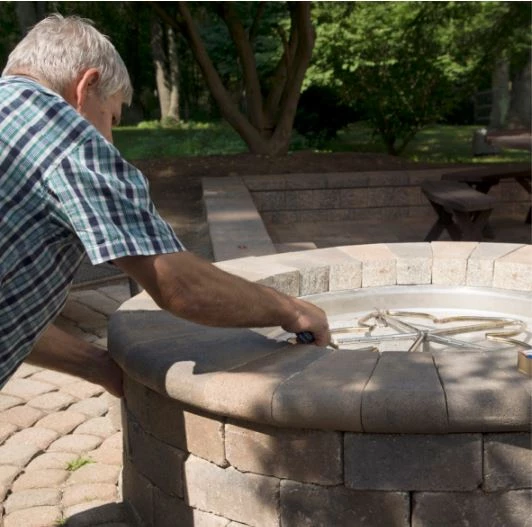Lighting a match-lit gas fire pit