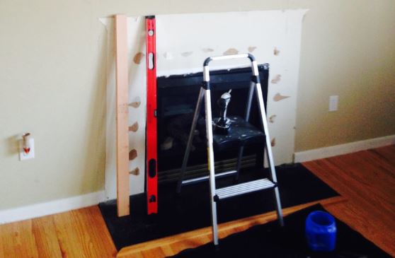 Fireplace opening being prepared for insert installation