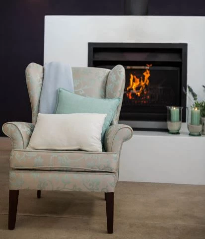 Wood fireplace insert converting a traditional hearth